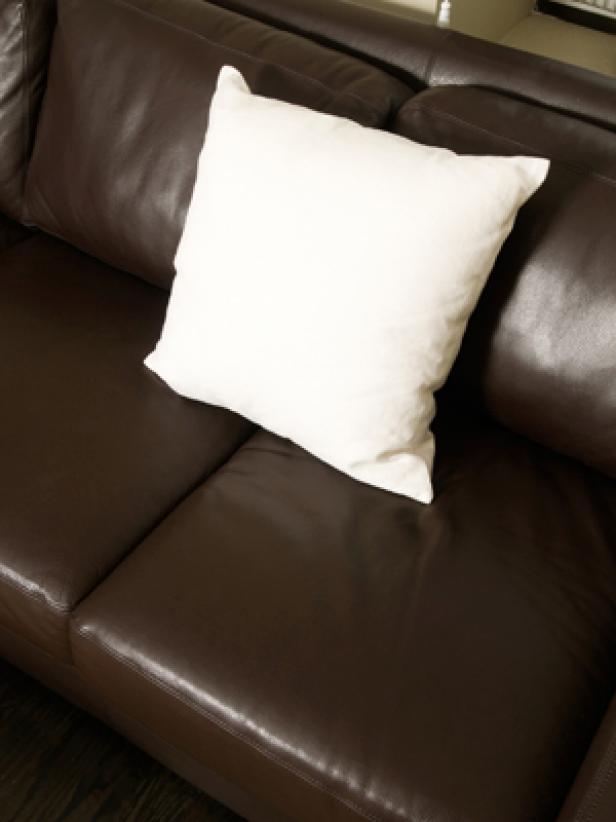 leather-sofa-with-white-pillow